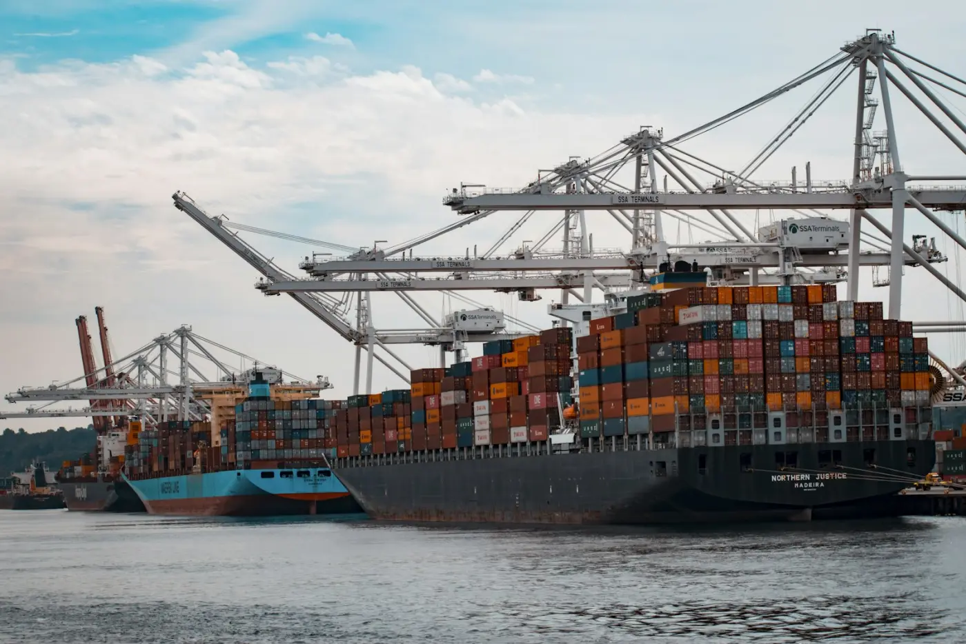 A container ship loaded with shipping containers at a port